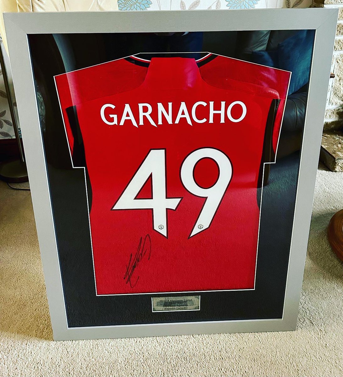 bkframing's tweet photo. FOR SALE (contact for price) - 

2023-2024 Manchester United Home Shirt by @adidas hand-signed ✍️ by ALEJANDRO GARNACHO - with CERTIFICATE OF AUTHENTICITY.

This is a nice large and clear signature &amp; red home shirt looks AWESOME against the silver frame/mount.

#idealgift https://t.co/Fjde22oZZ6