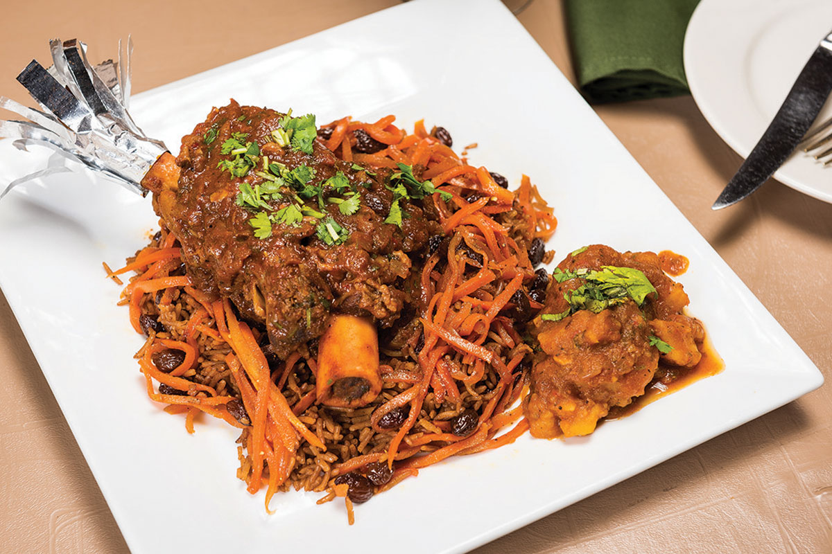 On Mondays we are closed, but don't worry! Our other two locations (DC &amp; Springfield) are open for dinner! You can make reservations on OpenTable or by calling the restaurant. Pictured here is our popular qorma, Lamb Shank Moghuli with upgraded qabuli rice!