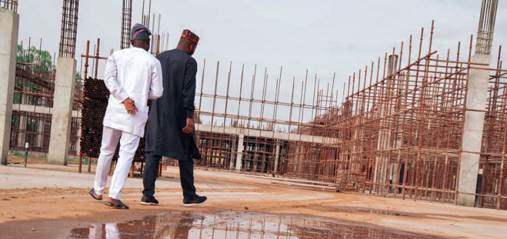 #THROWBACK This is a construction site from one of Gov @elrufai’s legacy projects under the #KadunaUrbanRenewal program; captured on 12/07/2020. The project has since been completed and put to use. Can you guess which project it is? Can you identify the two officials?