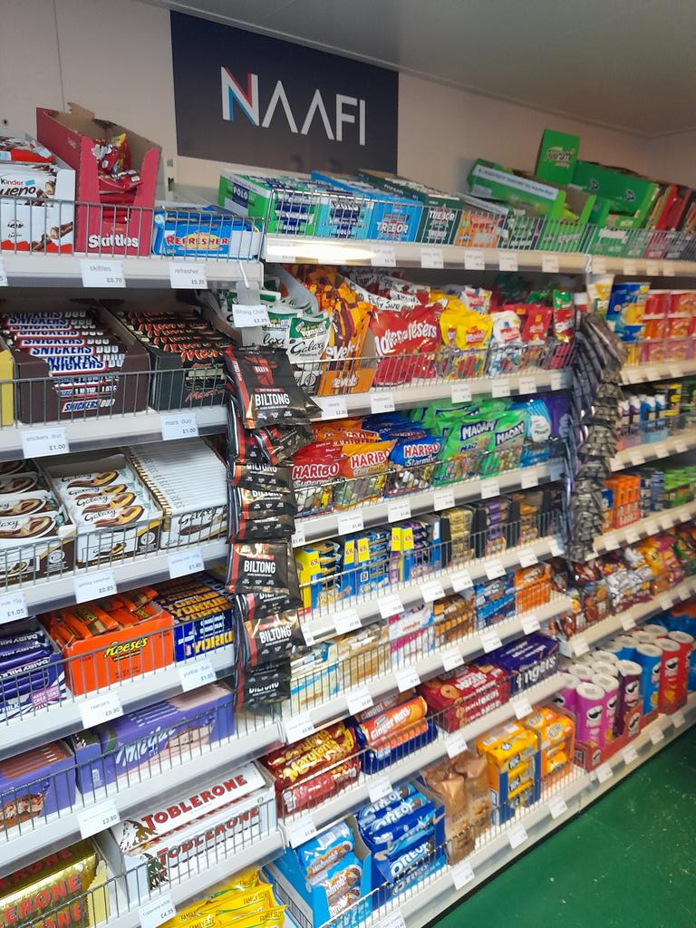 A boost for morale and a first for @RFAHeadquarters Ships - a spanking new @naafisocial shop! Ships company and Embarked Forces will now have access to snacks, sweet treats, and toiletries whilst deployed. Captain Wingrove cut the ribbon to declare the shop open for business 🍫