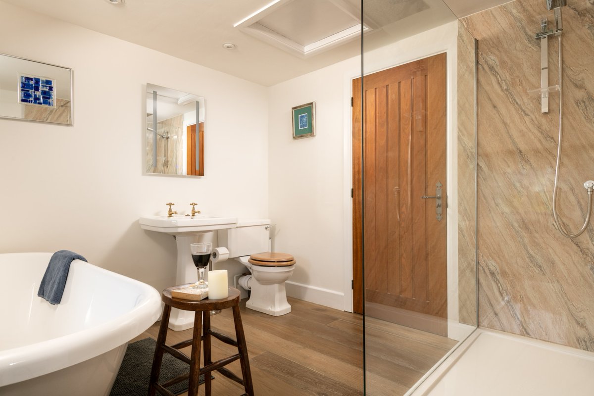 We put as much attention to detail in the bathrooms at Rill House as we did elsewhere with walk-in showers with Rain Shower &amp; normal shower heads &amp; the wonderful bath with village views. Don't worry we have a special film on the window so you can see out but no one can see in ;-)