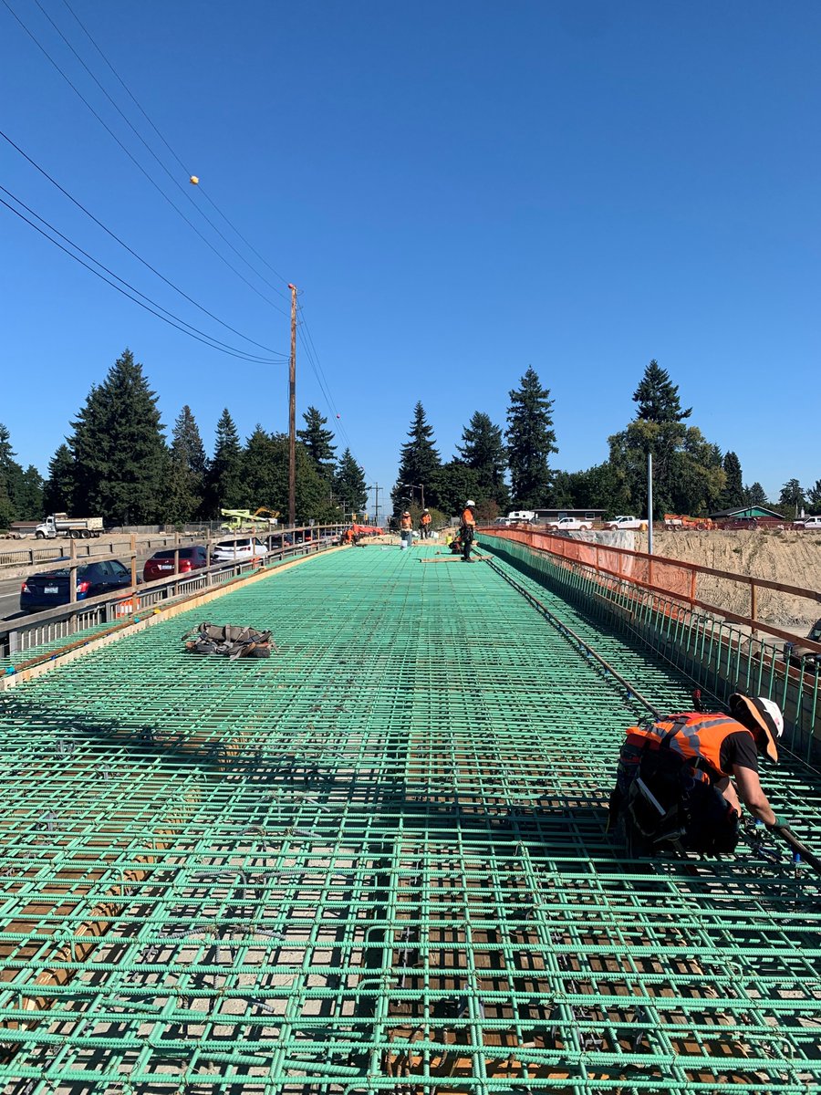 wsdot_traffic's tweet photo. A tale of two bridges. Crews are making great progress building new northbound I-5 flyover ramp for the new SR 509 Expressway and placing rebar on the southern half of the new S. 216th St. bridge.
More: https://t.co/Ipjyk5Io5Z, https://t.co/LamsMR5JMe. #SeaTac #SR509 https://t.co/VKrptVcVWf