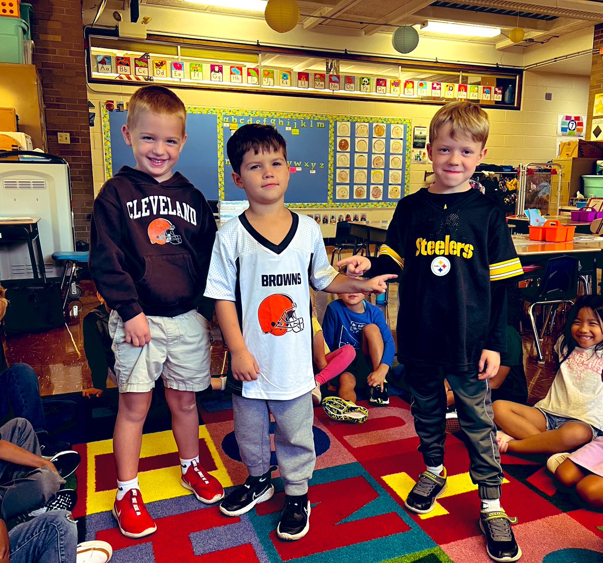 The cutest rivals EVER! 🤎🧡 VS. 🖤💛 This teacher will definitely not be able to stay up to watch the whole game,  🥱 so these cuties will have to give me the run down tomorrow! 😆