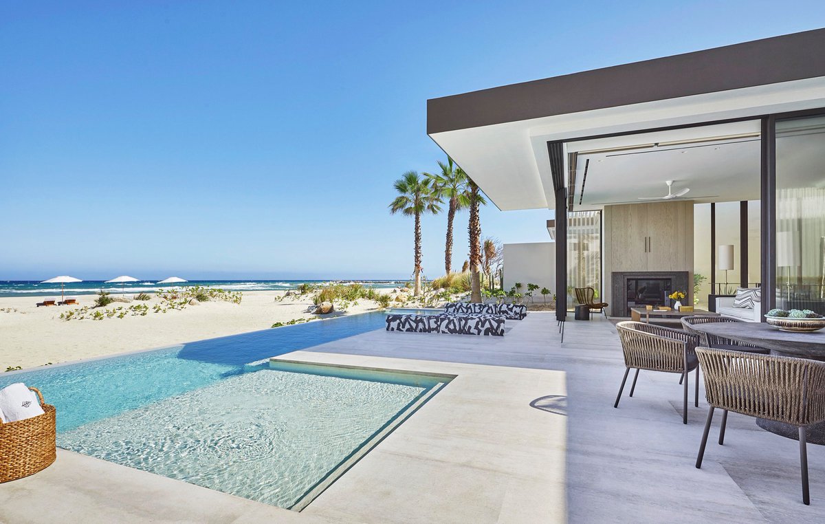 Floor to ceiling windows invite the outside in at our Three Bedroom Beachfront Presidential Villa, which features four private pools, lavish living areas, and boundless views of the Sea of Cortez.