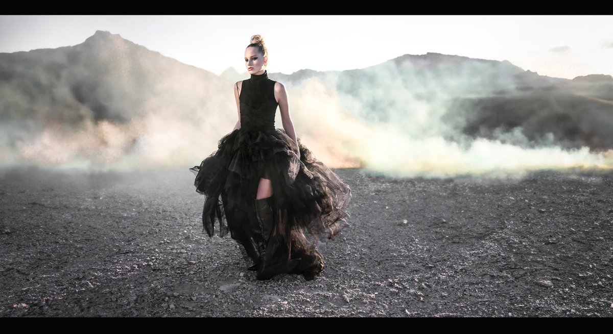 TravisWKeyes's tweet image. In a realm where textures, tones, and tales collide, I introduce todays cinematic portrait. Picture the elegance of high fashion, the intrigue of steampunk, and the vastness of sci-fi all converging on a lone mountain peak enveloped in mist. Are you captivated yet?