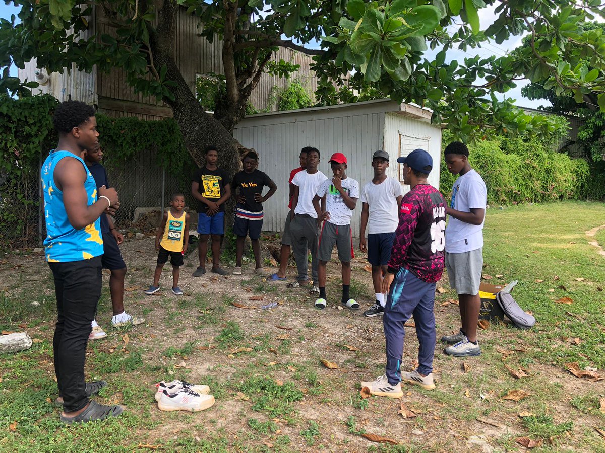 Coach Serame introducing cricket to boys from the inner city along with under-19 standout Antonio Harris 🇧🇸