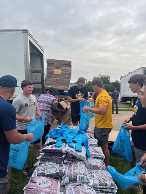 The guys giving back to the community by helping out at the Plains Food Distribution!