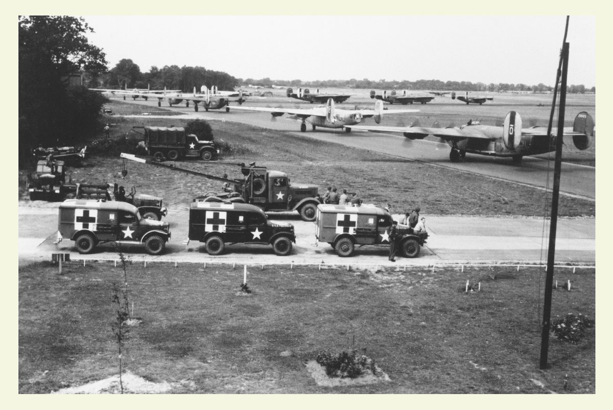 Field ambulances standby as B-24 Liberators of the 44th Bomb Group line up for takeoff at Shipdham in Norfolk.