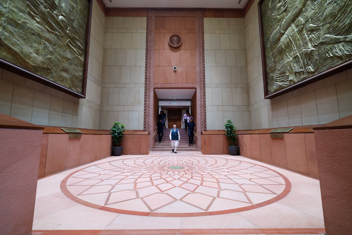 narendramodi's tweet photo. Commencing a new chapter in India's vibrant democracy, the new Parliament building stands as a beacon of hope and progress. It symbolises of our nation's aspirations and the boundless possibilities of our future. https://t.co/YGc9Q2EMNW