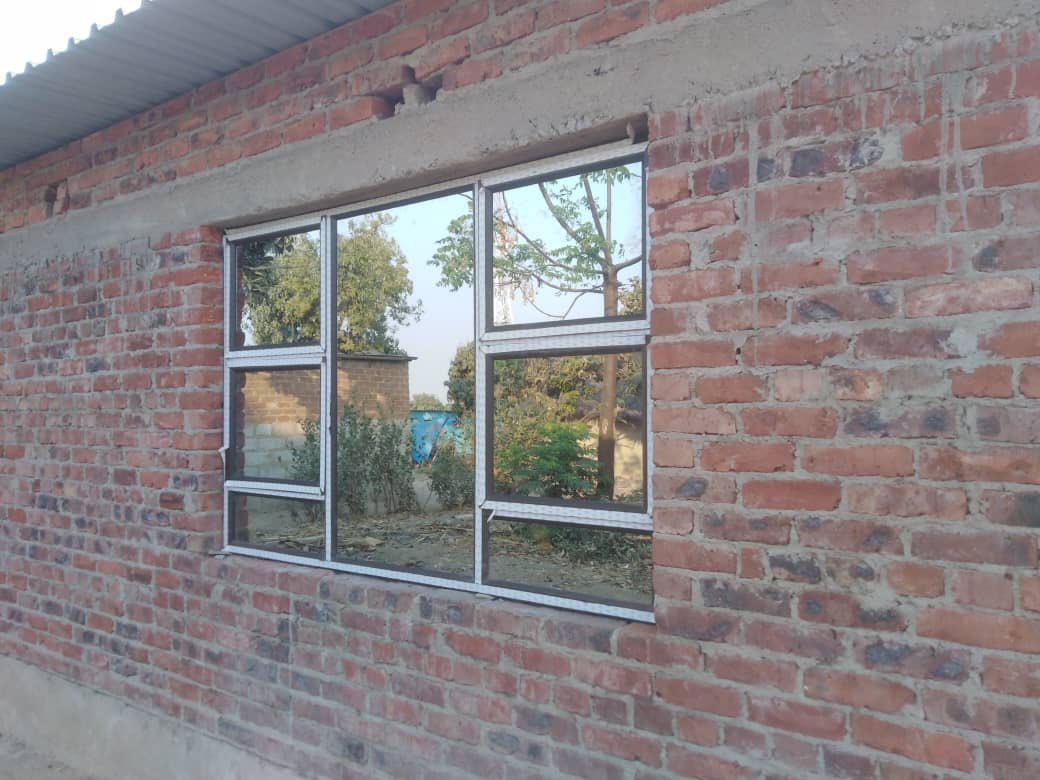 Project25zim's tweet photo. Our silence was not inactivity! This week we completed the windows of all four classrooms. 
Although the classrooms are already in use, we are working day by day to make small but significant improvements #WeWillFinishThisSchool
#Project25 https://t.co/tVOnwzp8Mf