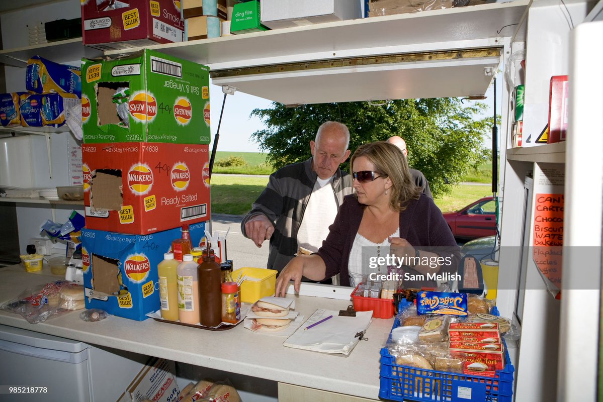 Breakfast rush at the Old Willoughby Hedge transport cafe in West Knoyle in the United Kingdom. Positioned at a lay-by outside West Knoyle in Wiltshire, the Old Willoughby Hedge caters to both commuters and passing traffic on the adjacent A303 trunk road (2008)