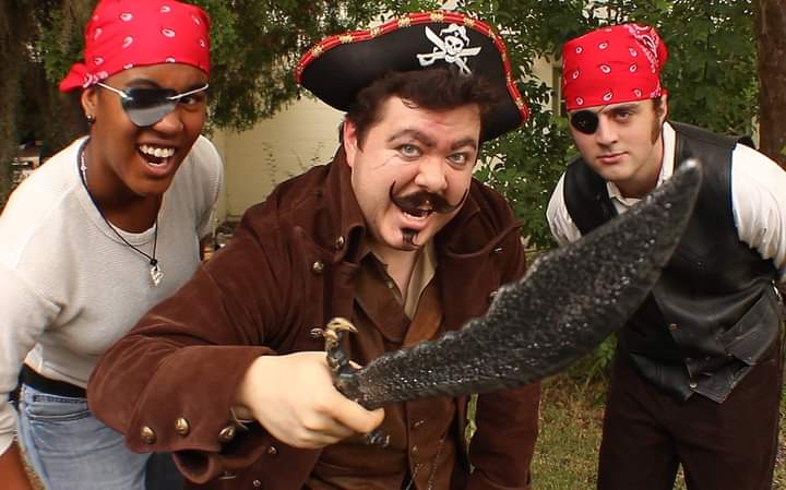 9 years ago, on Talk Like A Pirate Day, Krispy Kreme would give 12 free donuts to anyone dressed like a pirate! So the band wore our finest pirate attire and pillaged the Daytona Beach Krispy Kreme for 36 donuts and didn't pay a cent! But our stomachs paid for it later...