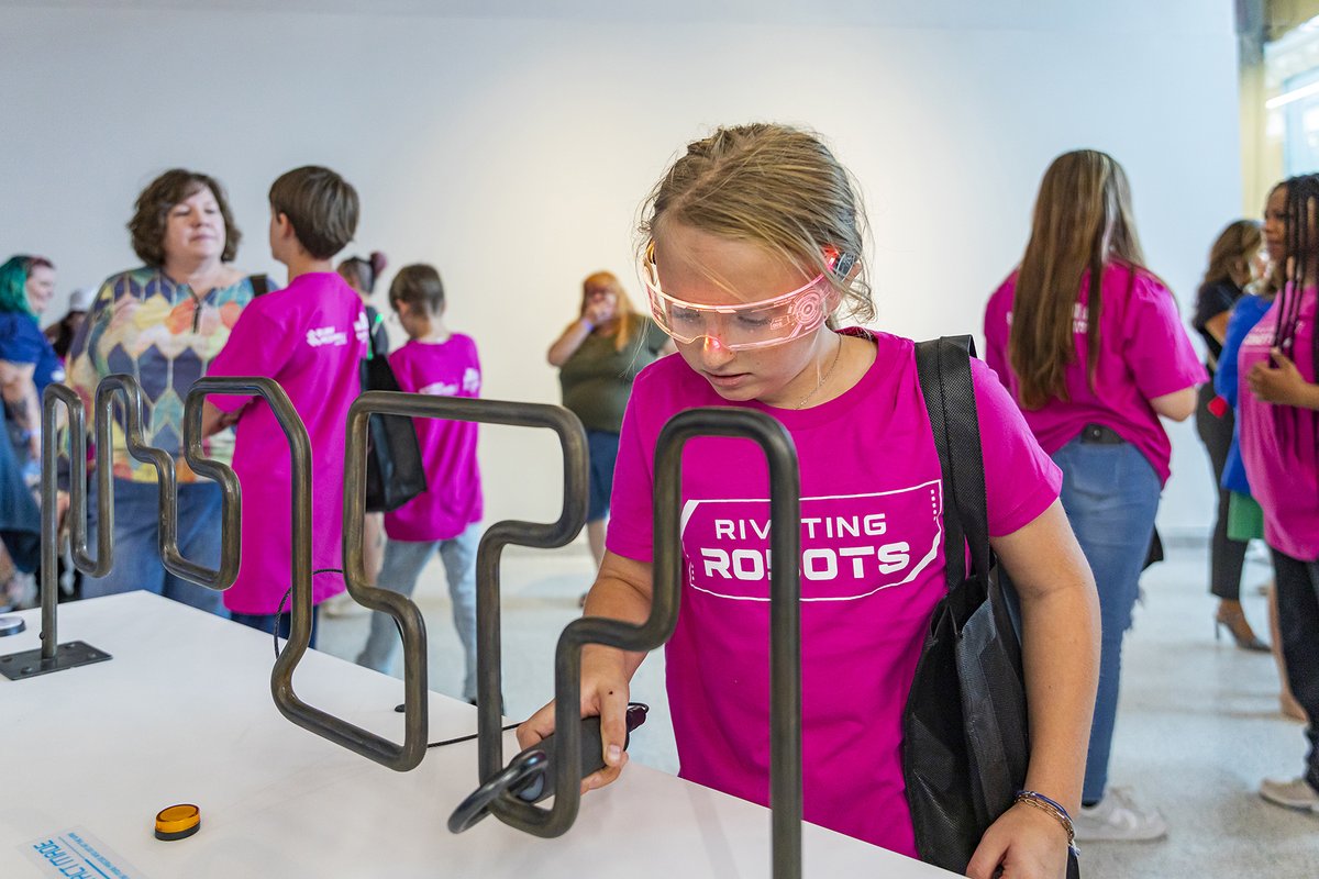 BurnsMcDonnell's tweet photo. Nearly 40 Raytown students and their teachers helped unveil the newest $1 million exhibit at Science City at Union Station: Riveting Robots. 

Read about this 2,800-square-foot space, educating guests about programming, coding and problem-solving. https://t.co/6lCPkDUjAp #STEM https://t.co/WoOrnZpnGJ