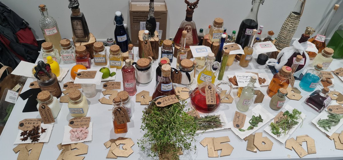 Aninok_Magnolis's tweet photo. And here's what my Bets &amp; Brews booth looked like ^¥^
Through potions and games, we got 221 Euros for the Eurofurence Charity UAnimals! Which isn't a lot compared to the whole sum, but I'll mark as a success anyway for a half-hidden, payment optional, slow turnaround booth x3 https://t.co/yJyZcM6tA0