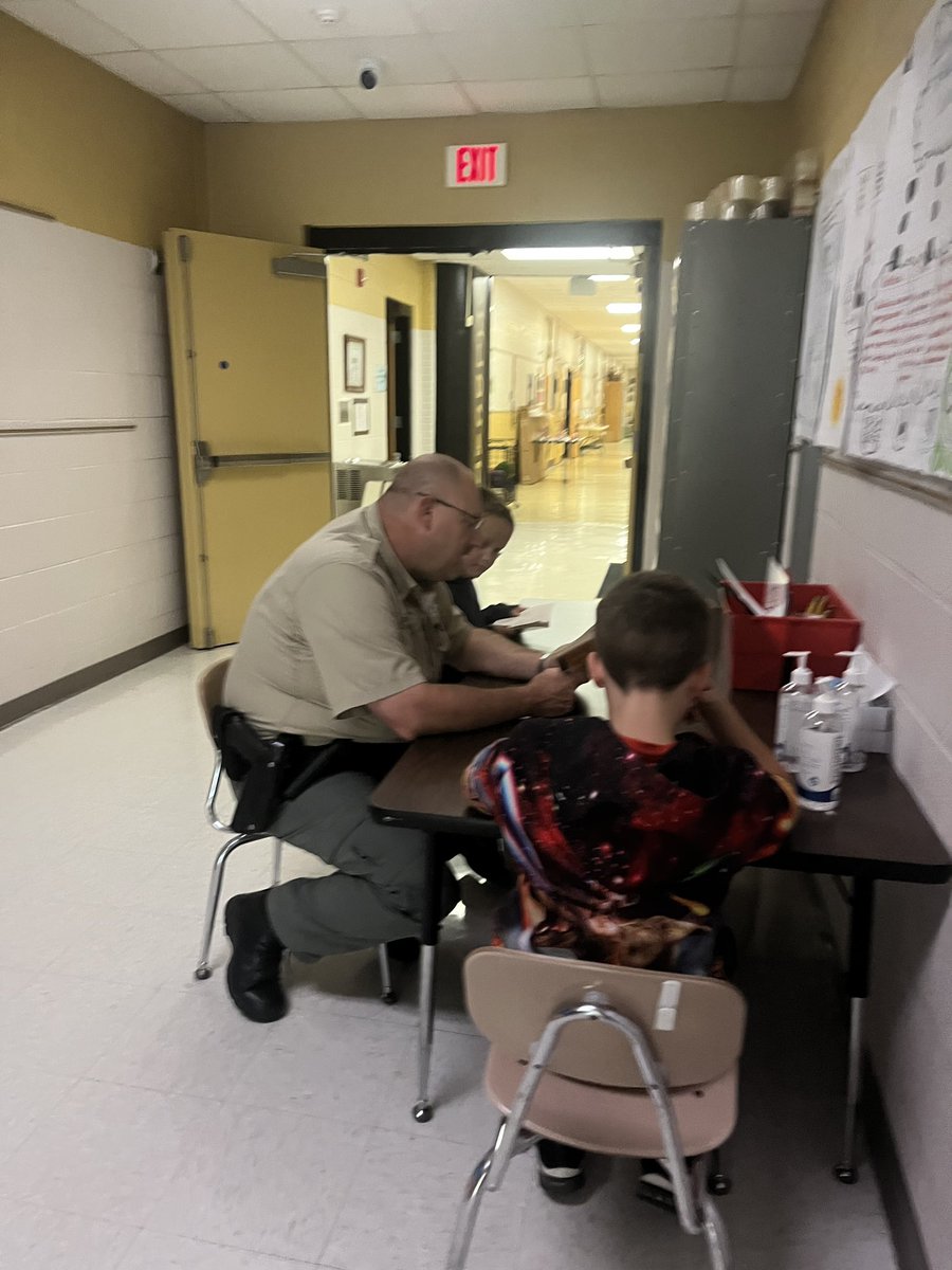 Deputy Chad loves working with OES students. Doing a book study with the boys.  #SumnerAchieves