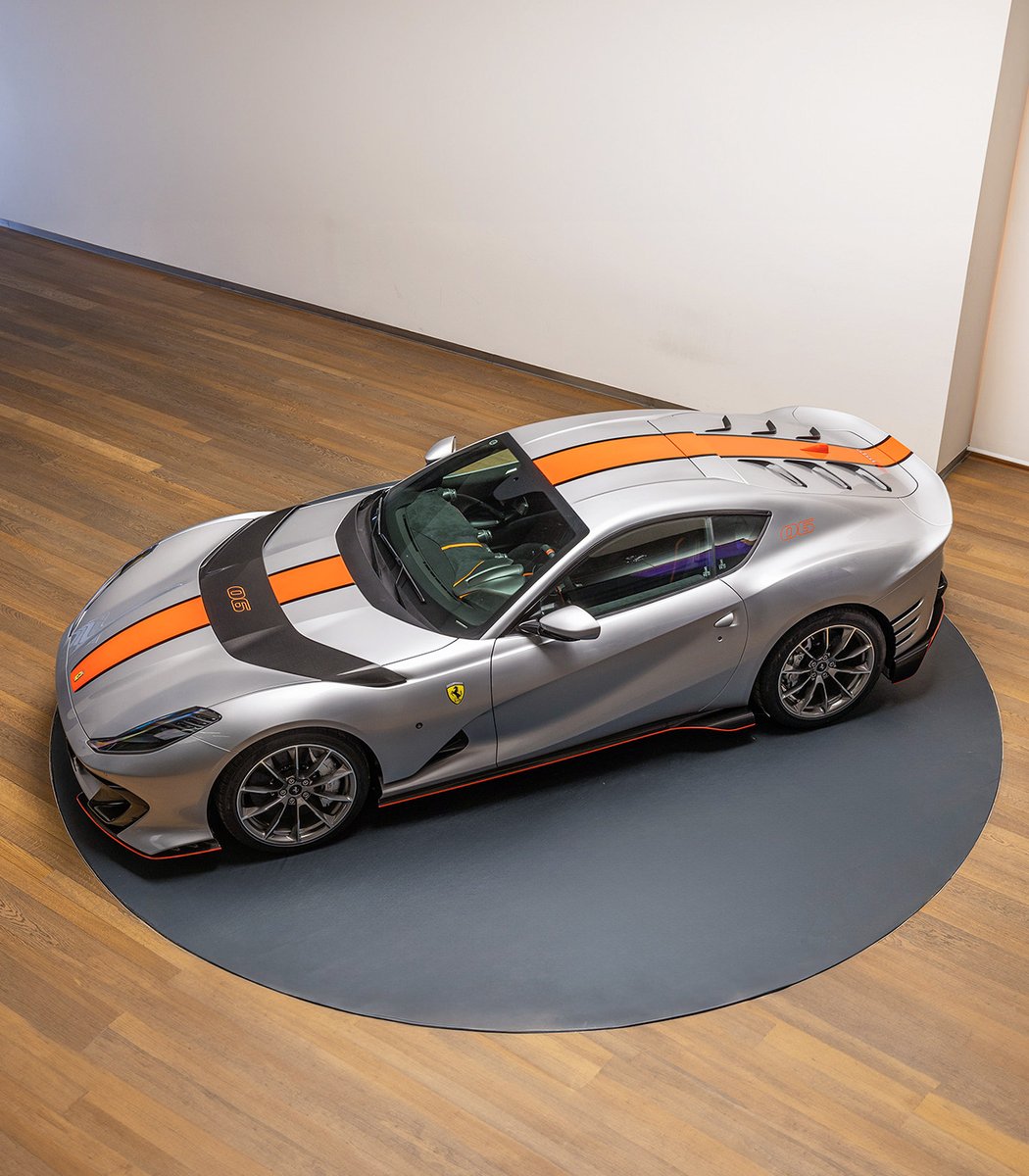 Ferrari's tweet photo. This #Ferrari812Competizione, realised by the #FerrariTailorMade programme is the definition of head-turning. Its matte Argento Nurburgring bodywork with Glowing Orange and Black livery in Nero DS makes it truly unique.

#Ferrari https://t.co/NNcKGPMsYX