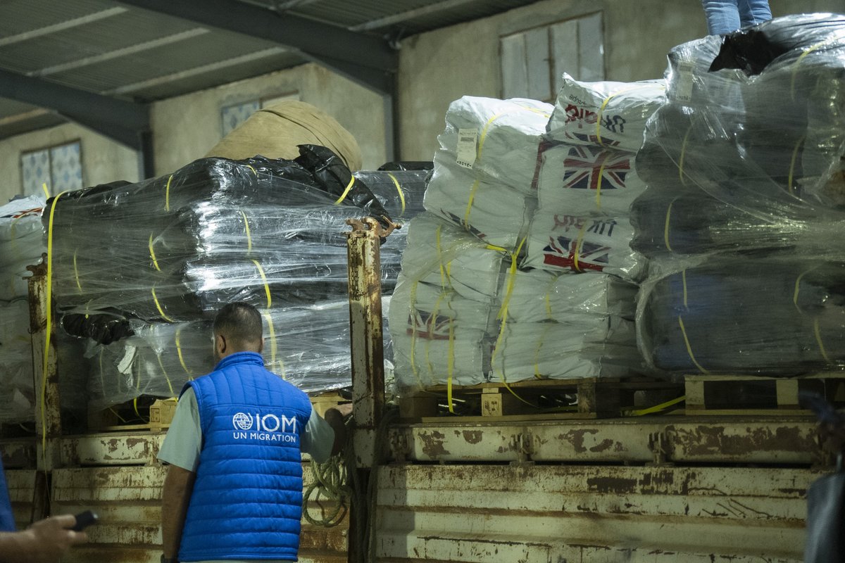 IOM_Libya's tweet photo. IOM in #Benghazi facilitated @USAID &amp; @UKaid  delivery of supplies for communities in eastern #Libya 🇱🇾 affected by #StormDaniel. The aid stocks include water filters, portable solar lanterns, shelter&amp;hygiene kits,blankets to provide life-saving assistance to those most in need. https://t.co/qVYmW8Ug9T
