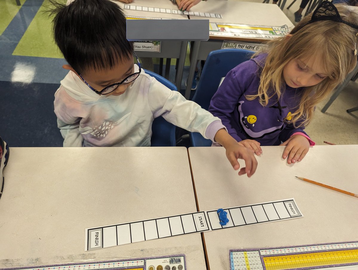 Grade ones <a href="/StEmilyOCSB/">St. Emily School</a> are learning to use a numberline today. We worked on counting and skip counting with a numberline.  Then, we played a dice game to get used to going forward and backward with partners. #ocsbmath