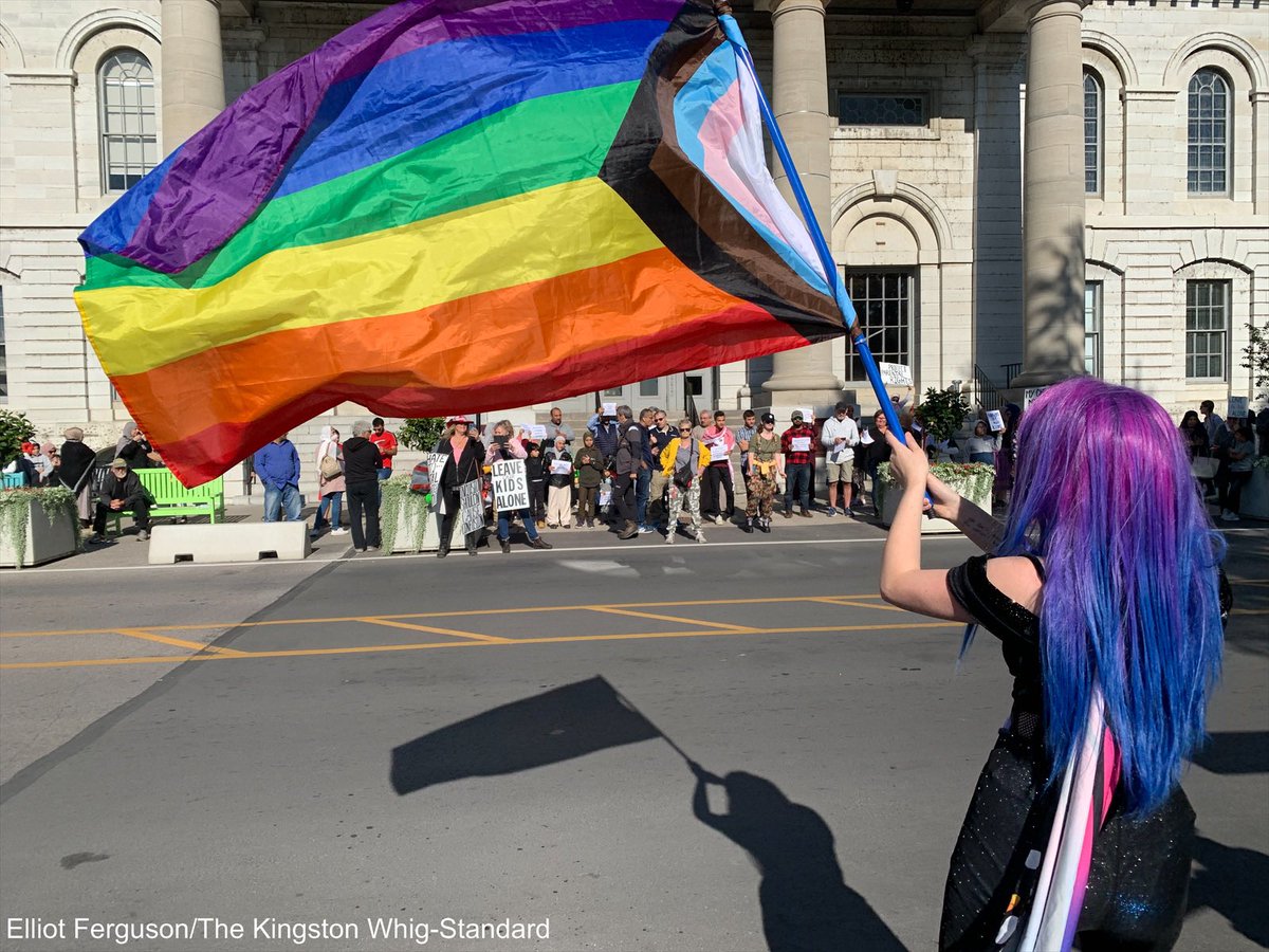 Drag Queen BeeWitched waves a rainbow flag at parental rights protesters in front of city hall in Kingston during a protest of school curriculum #ygk