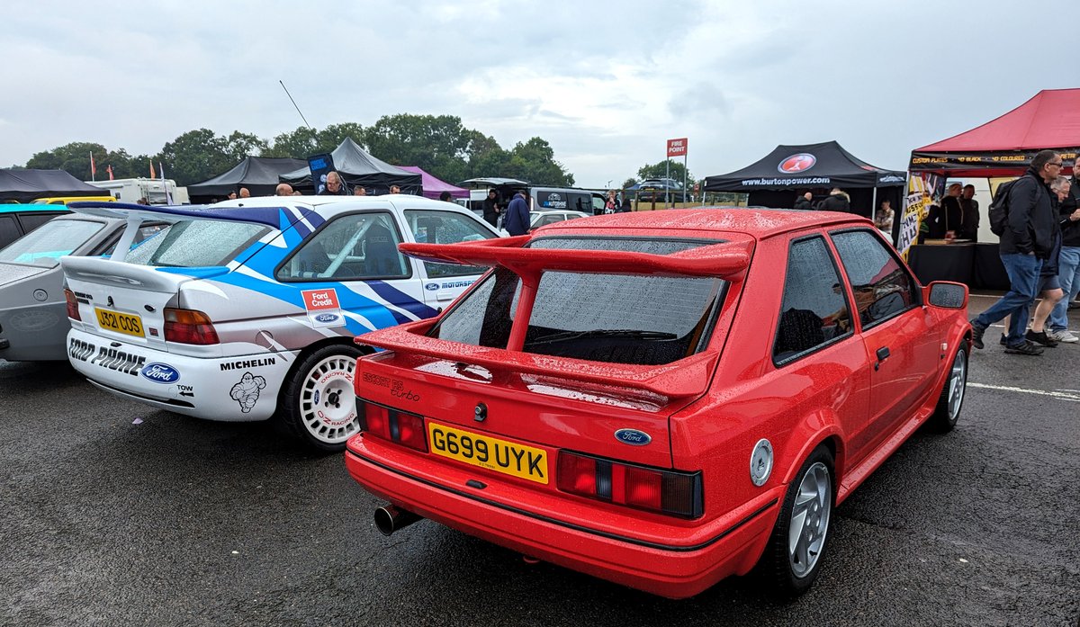 TOGTanner's tweet photo. Heres a #FastFord to start a debate over, Lovely red #Ford S2 #RSTurbo, pretty standard 90's spec, however it has a cosworth style whaletail on it. Would you keep the whaletail or ditch it ? #BrandsHatch #FordPowerLive (me, i would ditch it) https://t.co/yVtE8D4mqF