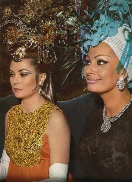 Wishing the divine in charm, talents, and of course looks Sophia Loren a very happy 89th birthday! Seen here with Grace Kelly at a ball in Monte Carlo, 1965