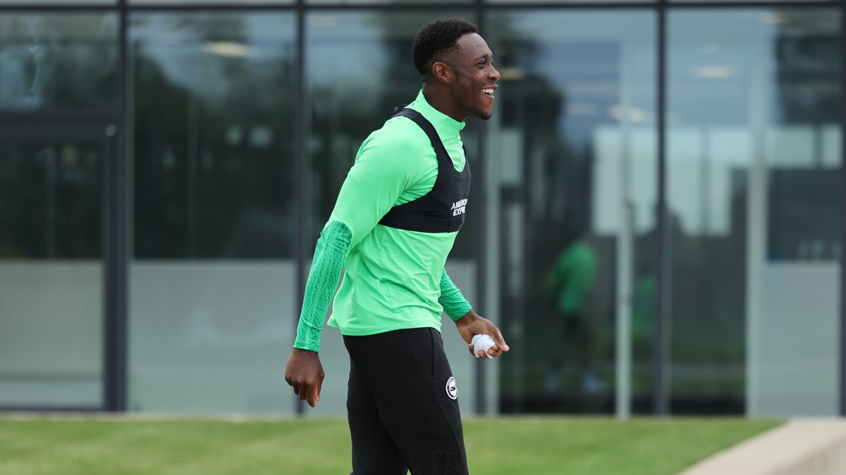 Danny Welbeck laughing as he walks out to train... he also has a rolled up a sock in his which he threw at us.