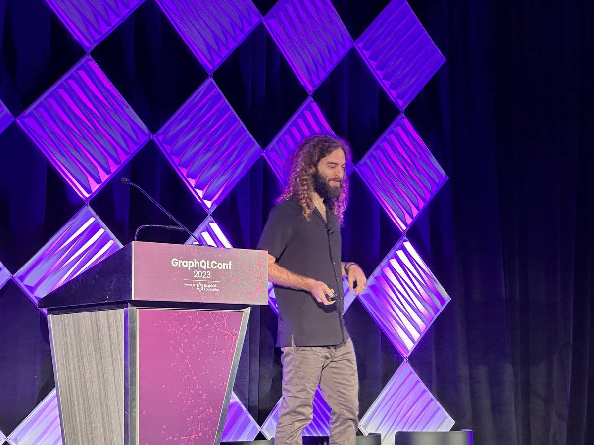 TheGuildDev's tweet photo. Uri uses recommend talks that he wants to see!

He also shares that #GraphQLConf is a big step for the whole GraphQL community and that the future and solution diversity will be  accelerated by open source. https://t.co/YiDLYuFfJX
