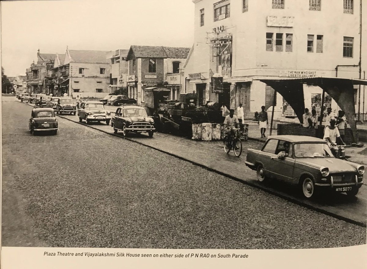 VinodJason's tweet photo. #OldBangalore: MG Road, 1962. The road is being tarred and on the right hand side if you zoom the picture, Plaza Theatre’s poster is showing the Hollywood movie ‘The Man Who Shot Liberty Valance’.

#Bangalore #Bengaluru #NammaBengaluru #MGRoad #PlazaTheatre https://t.co/88TNwrWyT7