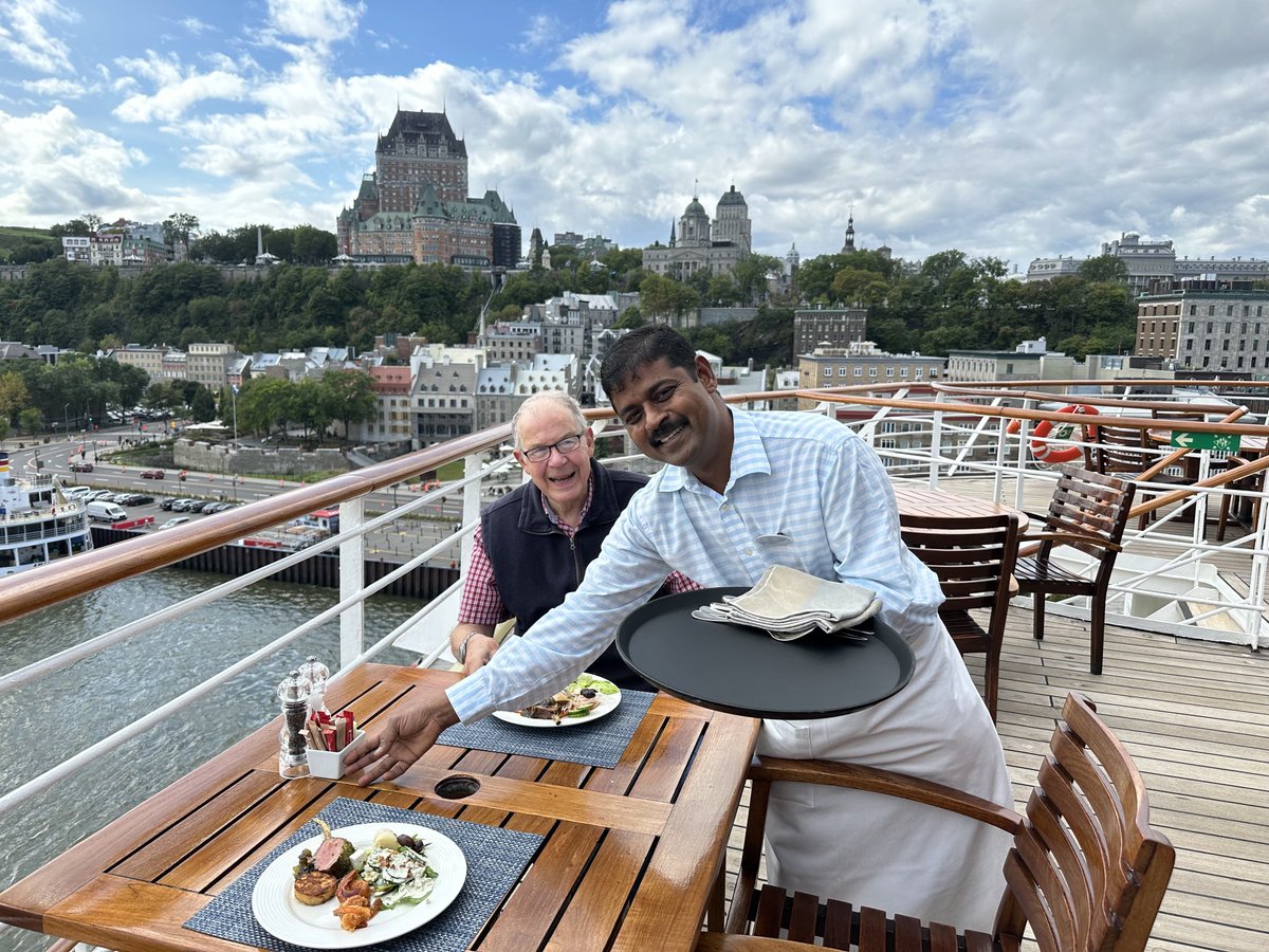 Our waiter is serving us lunch on on the back deck of Crystal Serenity docked in Quebec City. #CrystalAtSea ⁦<a href="/crystalcruises/">Crystal Cruises</a>⁩