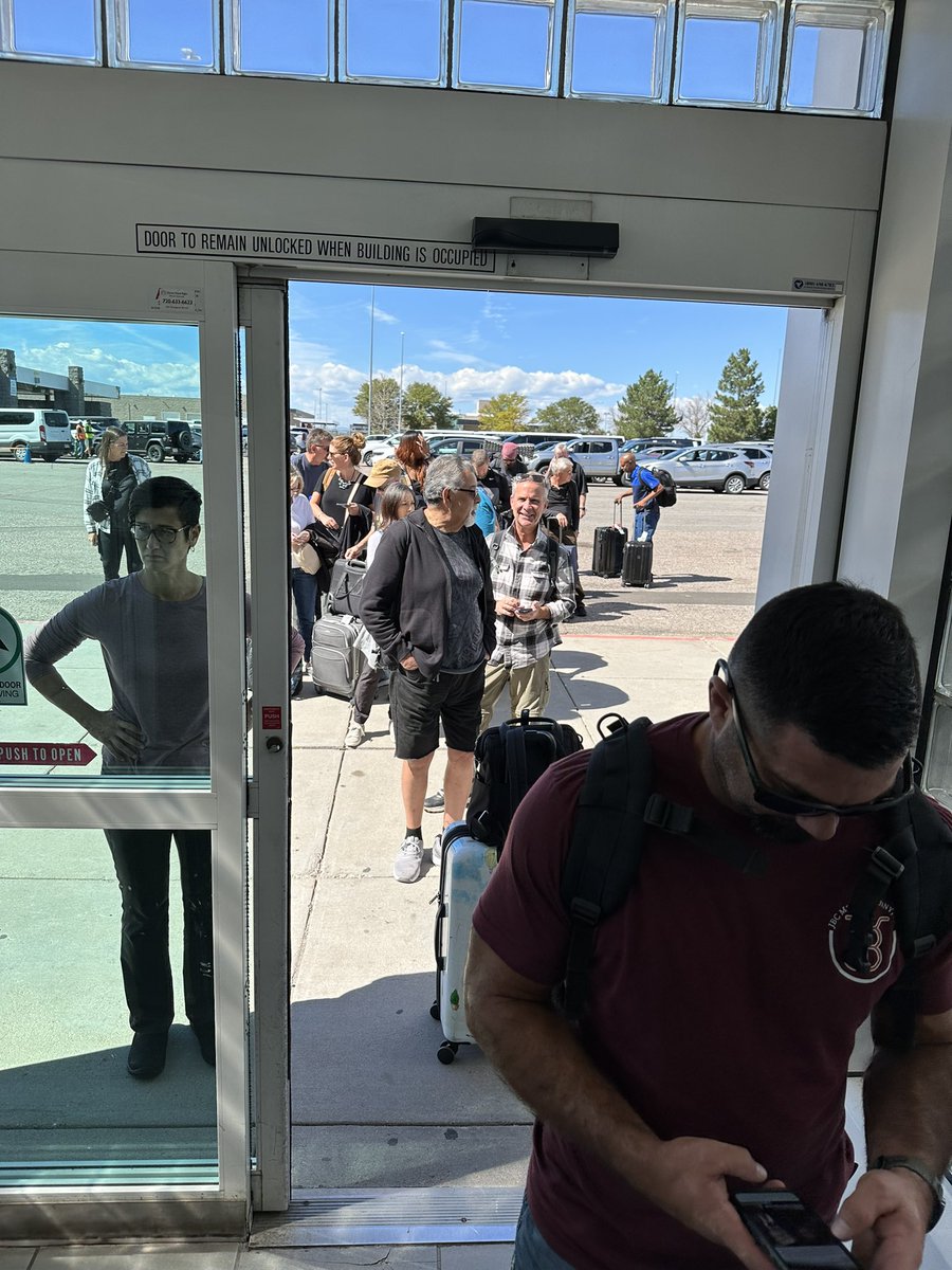 Worldin80Drinks's tweet photo. If you’ve rented from @Budget my advice is to cancel. Part of the line at  @DenverAirport.   So far 30 minutes &amp; Probably another 90 after online pre-check. No customer service. In 40 years of travel I’ve never seen a rental car counter line like this one! https://t.co/ErC6GyiZxi