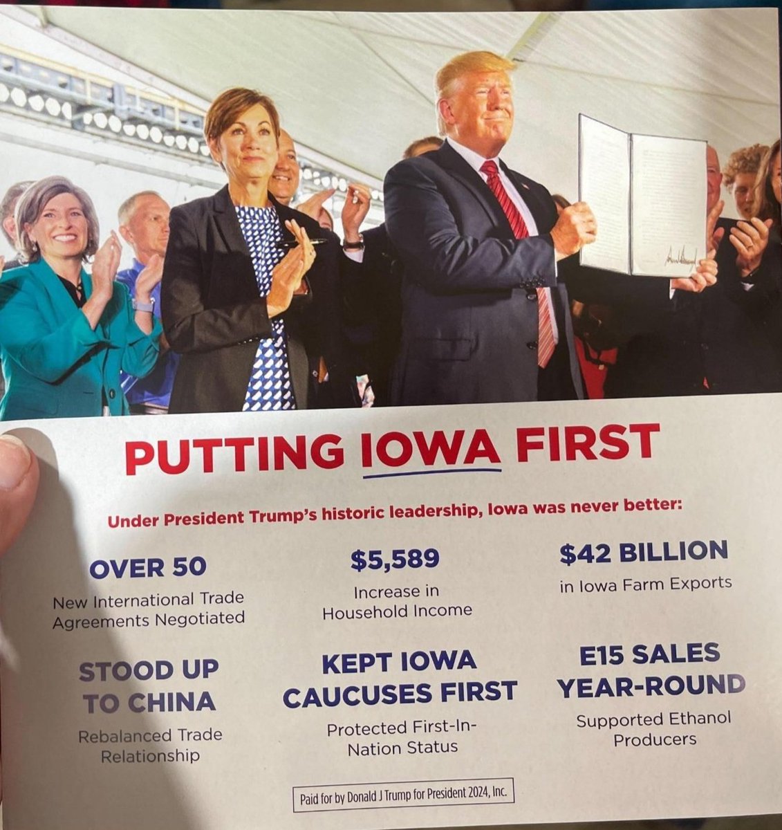 CurtisHouck's tweet photo. Trump is passing out campaign literature at his events featuring Governor Kim Reynolds, whom he has repeatedly attacked and said that he does not invite to his events. 

Reminder: He also called the heartbeat protection law she signed in July "a terrible thing."

📸: Source https://t.co/tMRX9jAn9I
