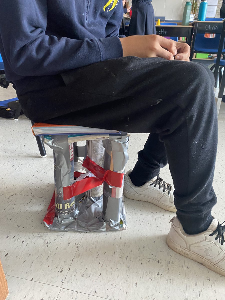 We built newspaper structures to hold up our textbooks. This group of grade 7’s went above and beyond and were able to build a structure so strong they can use it as a chair!