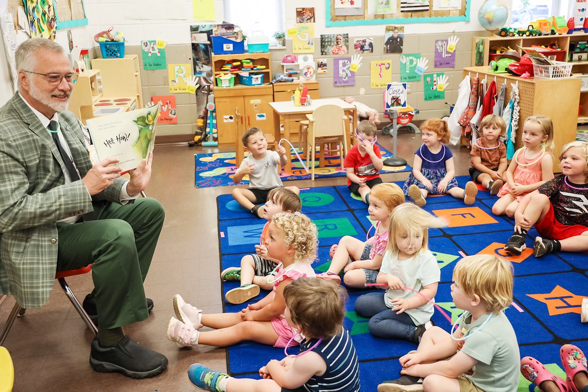 NWSCC's tweet photo. NWSCC President Dr. Jeff Goodwin dropped by the NWSCC Child Development Center this morning and read to our little patriots on "Reading Makes Us Glow" day! 💡📖📚 #nwscc #aefamlit https://t.co/jBOEQzFZWE