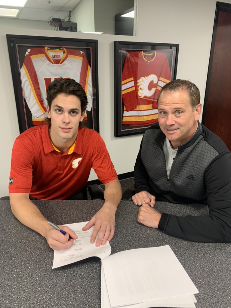 NHLFlames's tweet photo. First @NHL contract: signed ✍️ https://t.co/EbM6PUuu6e