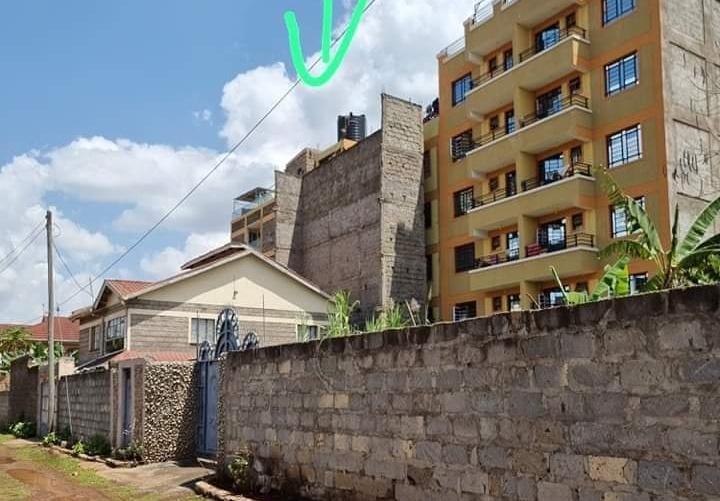 A maisonette owner puts up a five storey boundary wall to maintain 'privacy' of their property after their neighbour builds an apartment block.