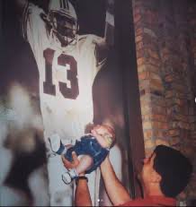 brettbeene's tweet photo. Ok, now a Brock Purdy fan. Wears 13 for Dan the man. His Dad was mega Dolphins fan. That’s baby Brock in photo with his dad. https://t.co/9chgJQe1rX