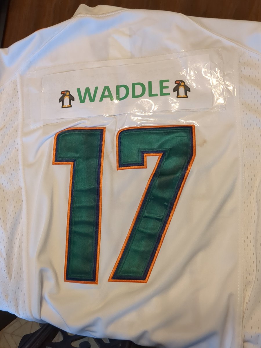 JasonGoulet's tweet photo. @D1__JW a Pats fan was so thrilled about the outcome of the game Sunday Night that he ripped off my taped on nameplate while exiting the stadium. 

Any chance you can help with a more permanent solution for my next away game in Philly? 🐬⬆️ https://t.co/iofyIvnO5d