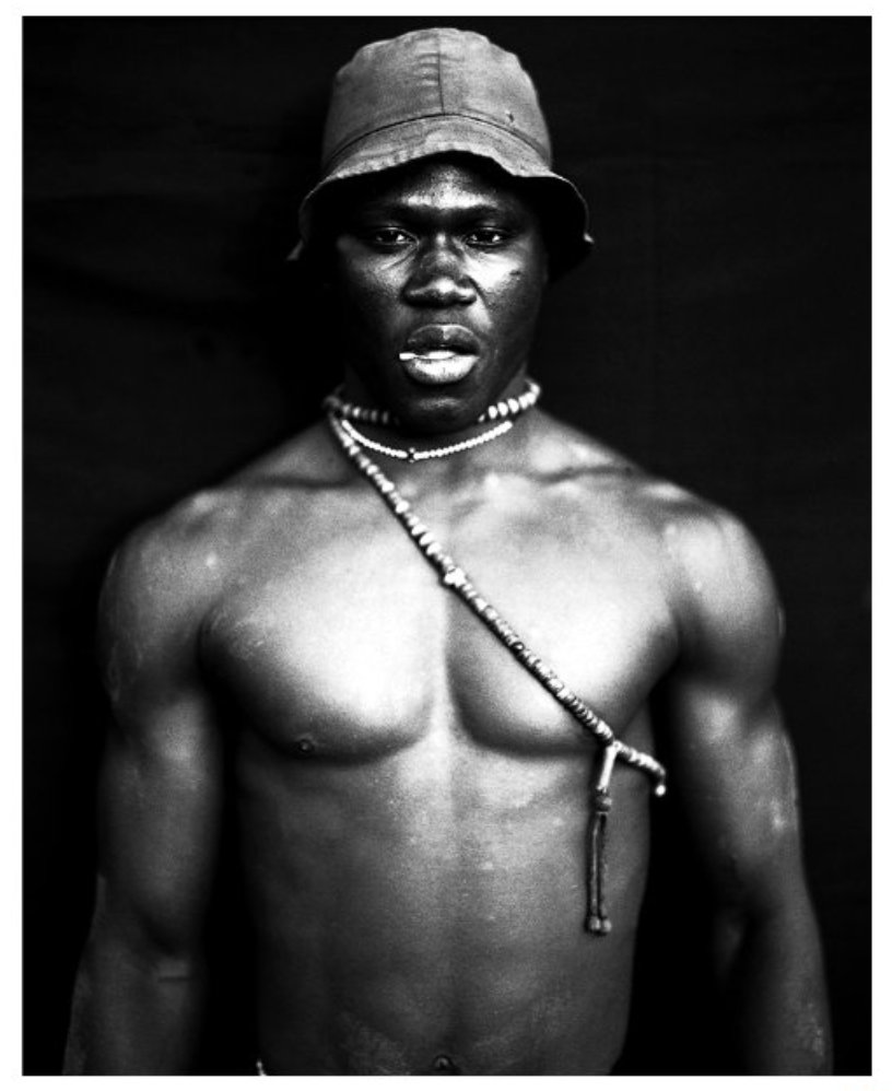 'The Wrestler' - Jason Florio's Fine Art #PhotographyPrints B&W Collection from West Africa, spanning 20 years | Please see website for both colour and B&W collections floriophoto.com/BLACKOUT-PORTR… #jasonfloriophotography #portraits @floriophotoNYC