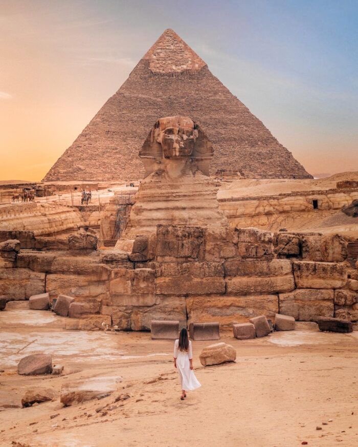 'Standing in awe before the Pyramids of Giza, a testament to ancient ingenuity and wonder! 🐫🌄 #Pyramids #AncientEgypt #TravelBucketList'