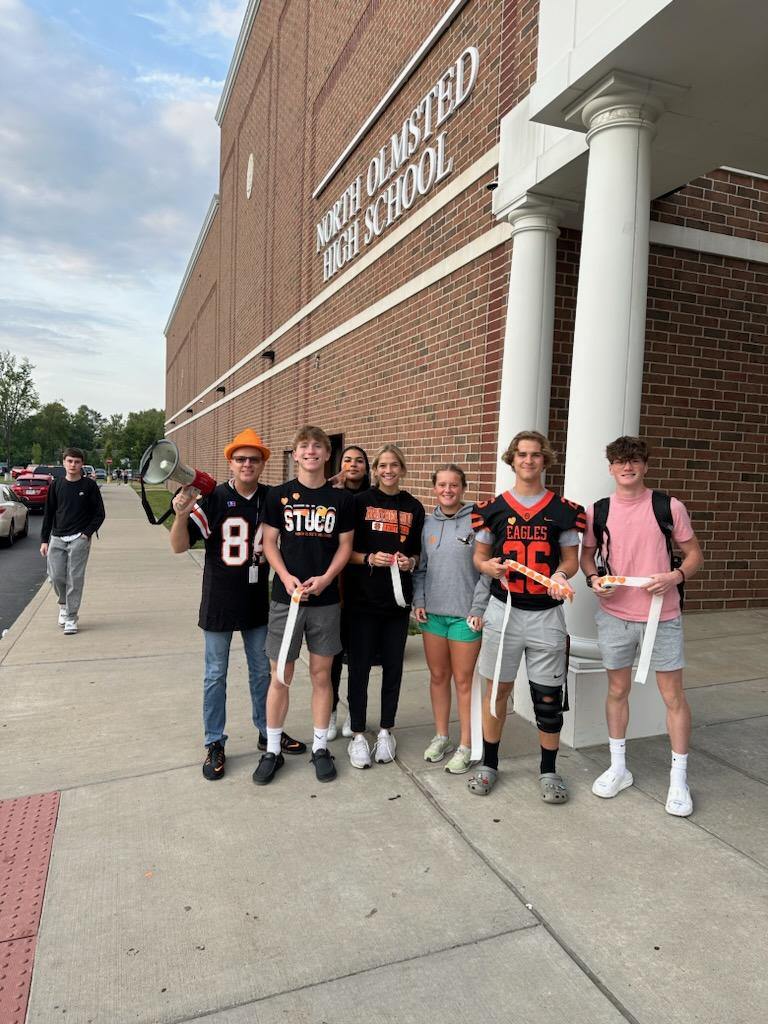 StuCo celebrating Homecoming NOHS style. Passing out Homecoming Heart stickers this morning to share Eagle Love.
(Mrs Hynes is hiding)