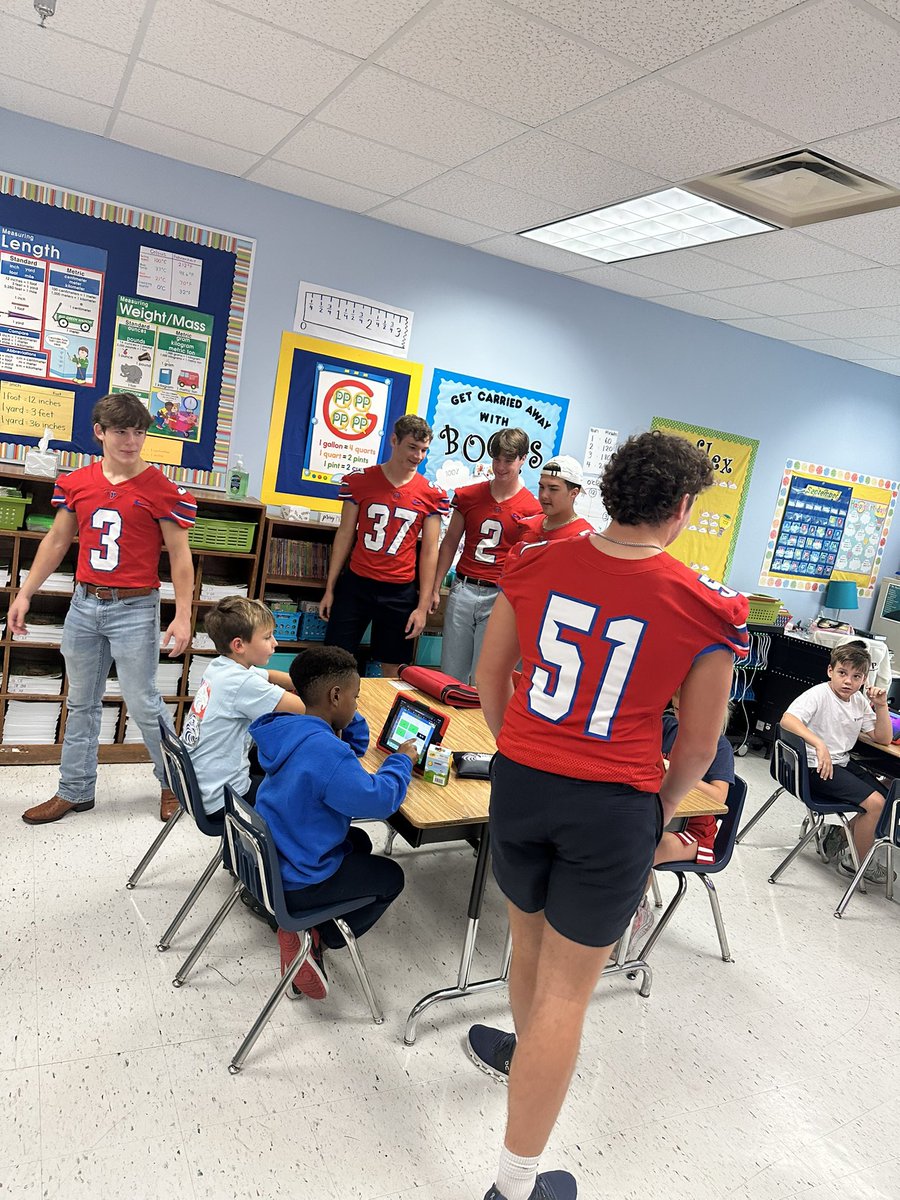 Some of our guys took a trip down memory lane to the elementary building this morning! Great way to kick off gameday and the little ones got a kick out of it! #GeauxEagles🔵🔴🦅