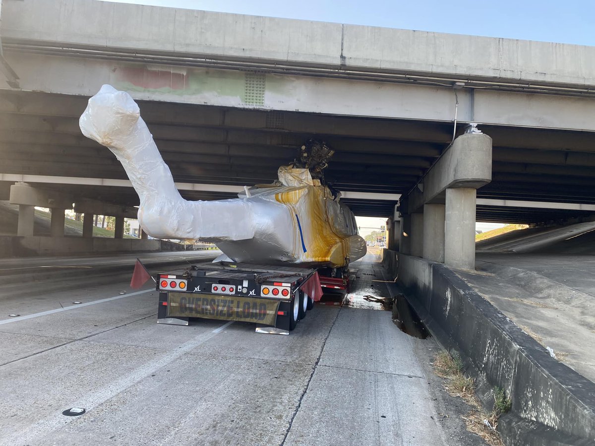 WBRZ's tweet photo. More photos of the helicopter that got wedged under the I-12 overpass at Range Avenue. DOTD is still working to remove the aircraft, but they do not believe the bridge sustained significant damage at this time.

Latest here: https://t.co/UsGgaQ3jah https://t.co/MT8r152FMg