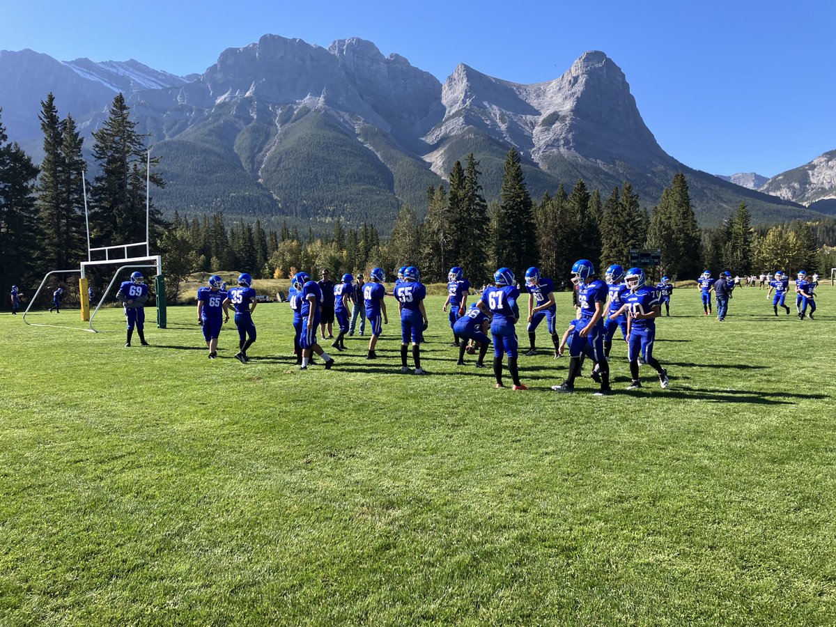 DaveRobertsVP's tweet image. Team time for ⁦@highwoodhigh⁩ Mustangs football. Kick off against Canmore coming up against this amazing backdrop.