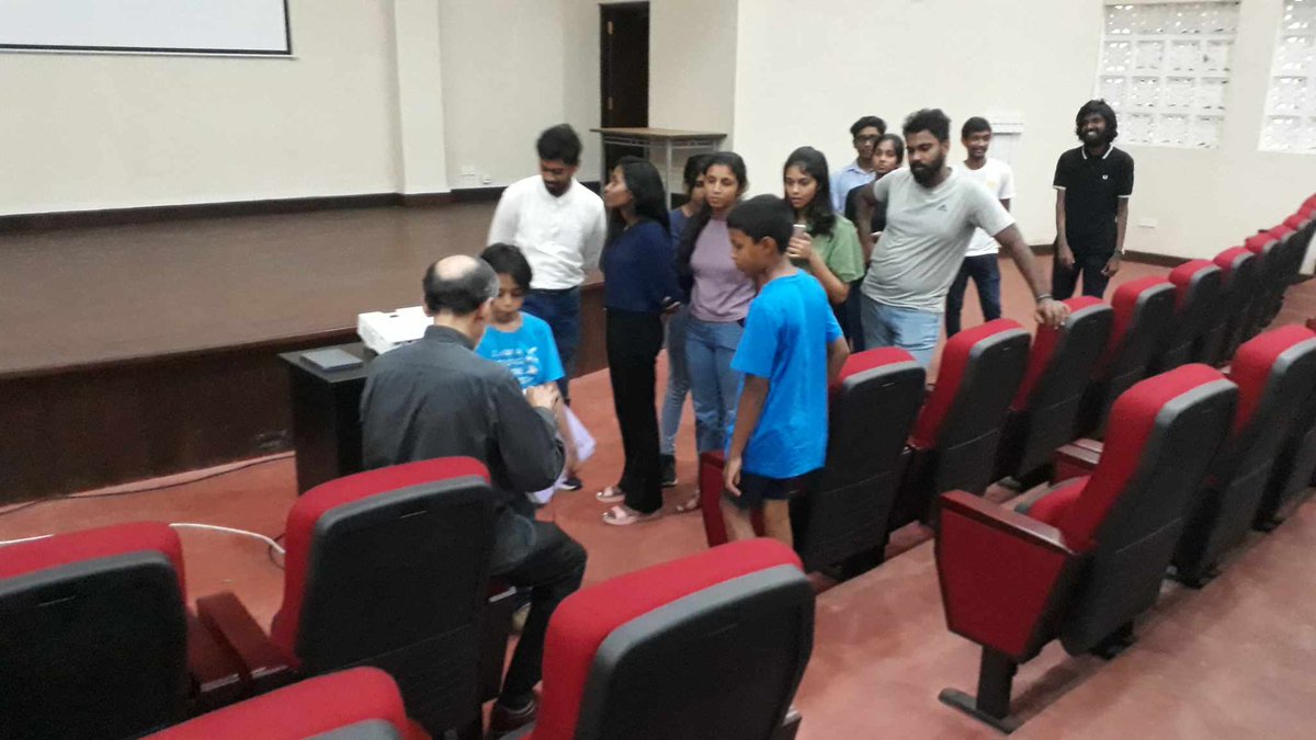 SamAlosha1's tweet photo. "In the resplendent setting of the University of Peradeniya Faculty of Science's grand auditorium, Me and mY brother Shane had the distinct honor of encountering the extraordinary scientist, Rohan Pethiyagoda. https://t.co/px5s9GOToU