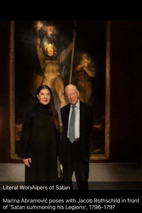 Okay, so about #Zelensky asking the real-world Luciferian Witch Marina Abromovich to be an ambassador for Ukraine...with an emphasis on helping rebuild schools for children.

This photo of her with Jacob Rothschild in front of a painting of Satan summoning his legions should help