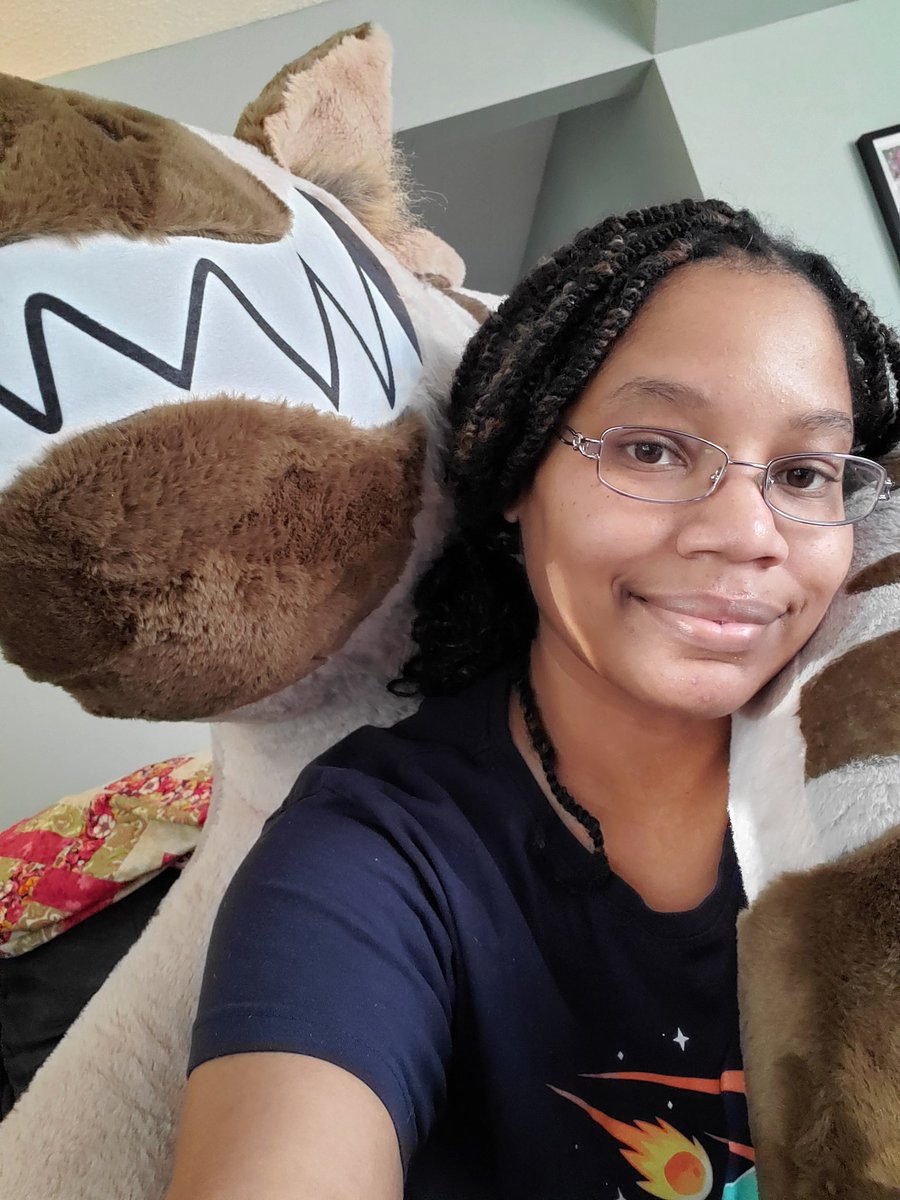 I wonder if this is how the shapeshifters in LK Hamilton's world feel when hanging with their species.

Feeling real Hyena Queen or "Oba" here with this gigantique yeen plush. Seeing how they're also Black women who are mainly werehyenas in that world, I'm really feeling it.