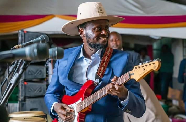 Governor Kawira Mwangaza's husband, Murega Baichu, will now play his guitar from home following interior Cs Kithure Kindiki's declaration banning Okolea rallies in Meru County.