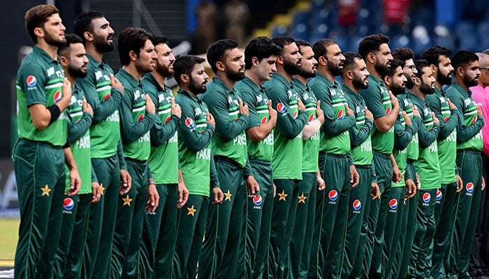 Pakistan cricket team in a huddle, discussing strategy during a match