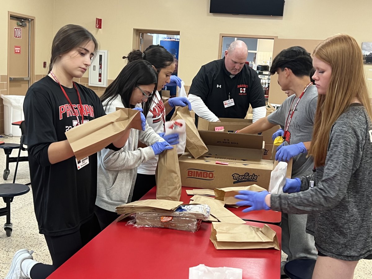 MaristChicago's tweet photo. As part of the Nutrition Unit and Health Planning lessons, students in Health class with Coach Heffernan ‘99 packed lunches for those in need. These packed lunches will go out this morning. These students are learning and doing good! #InTheClass #Marist https://t.co/tg36zv1EH8