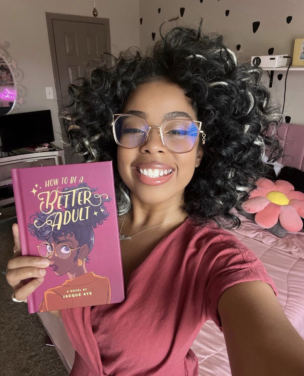 Photo-dump of me holding the book I wrote ✨